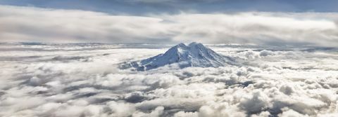 Jonathan Dong, a student and freelance photographer, created a panoramic photo (cropped here) of Washington's Mount Rainier by laying five images horizontally. "It was the only peak in view that was capable of rising up to bathe in the morning sun, shining in the light, but yet completely solitary."