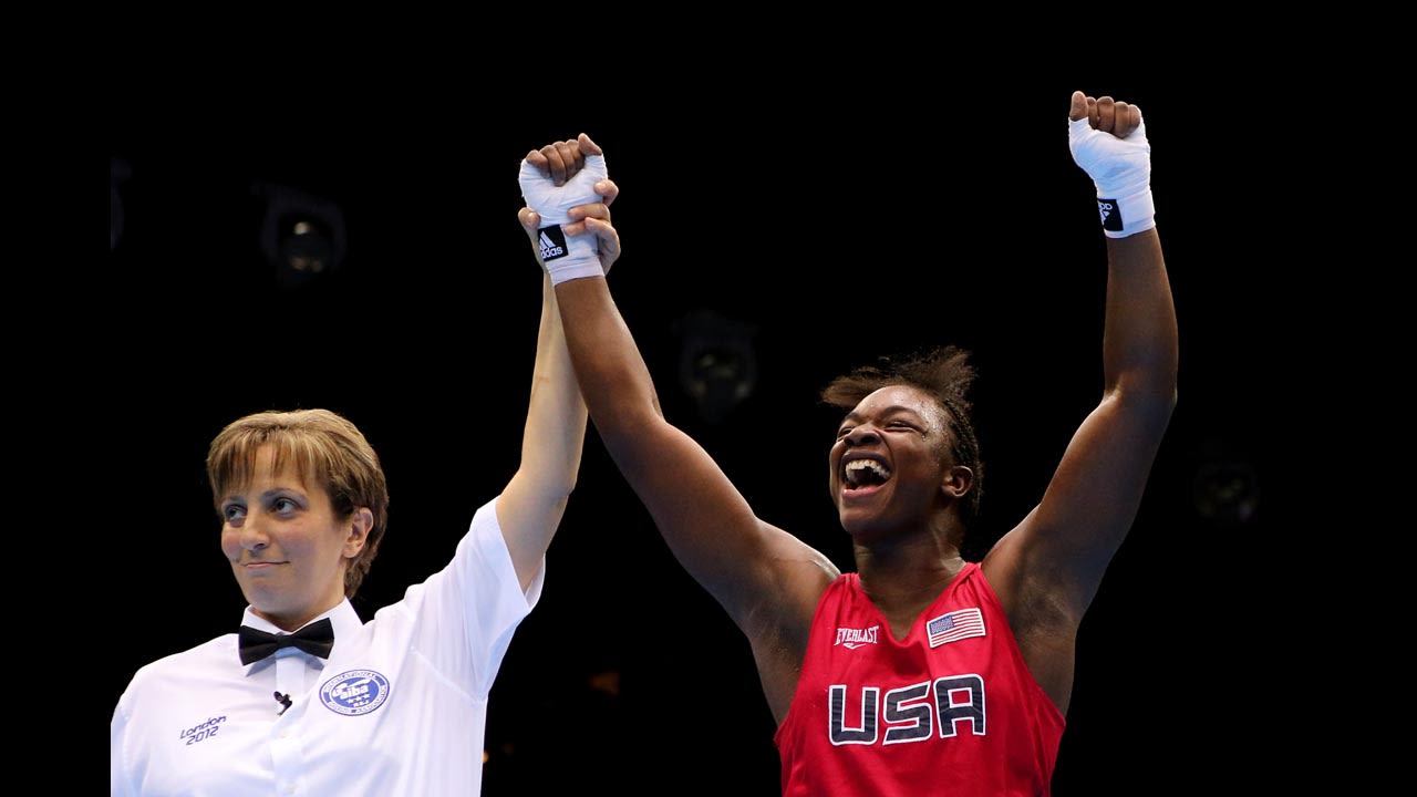 Shields celebrates her victory as the referee announces her win.