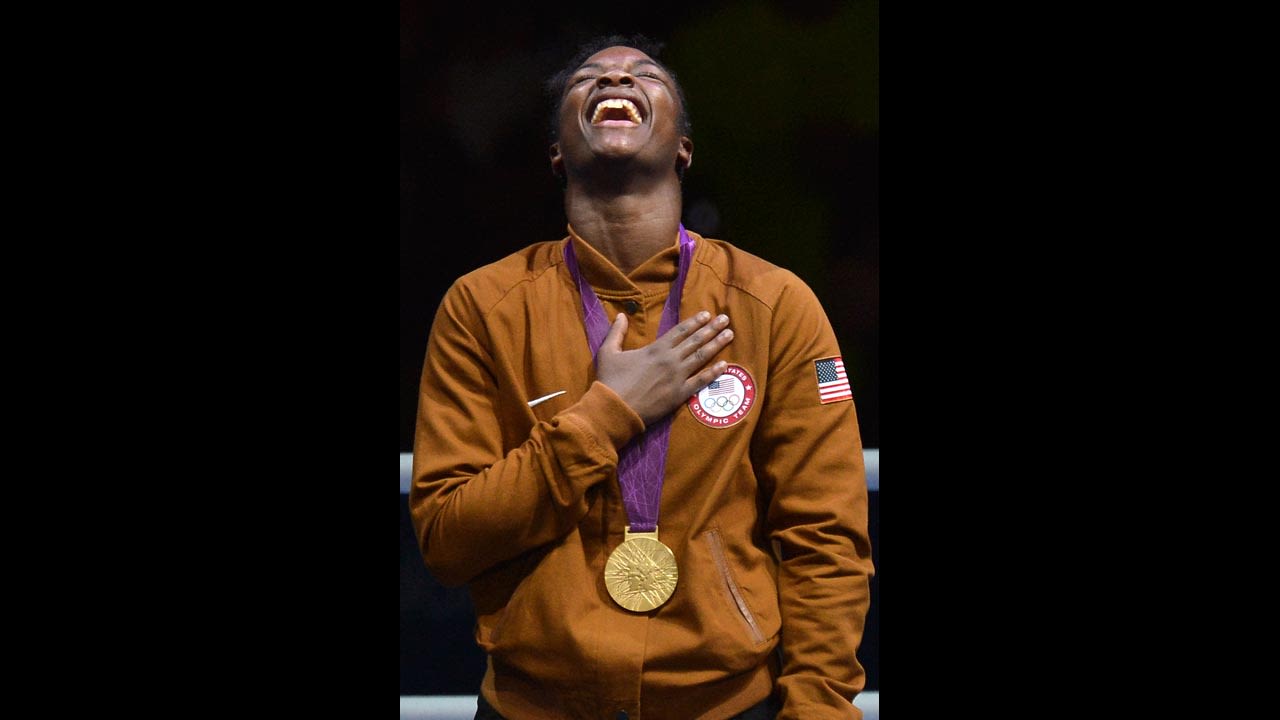 Shields laughs on the podum after receiving her gold medal.