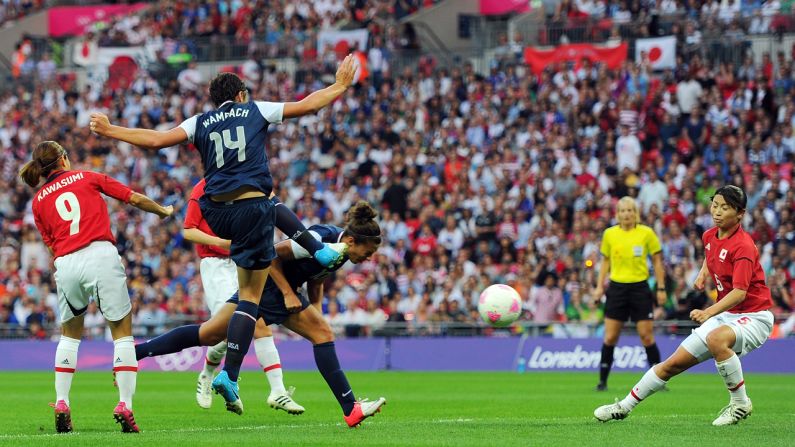 Carli Lloyd heads in a goal.