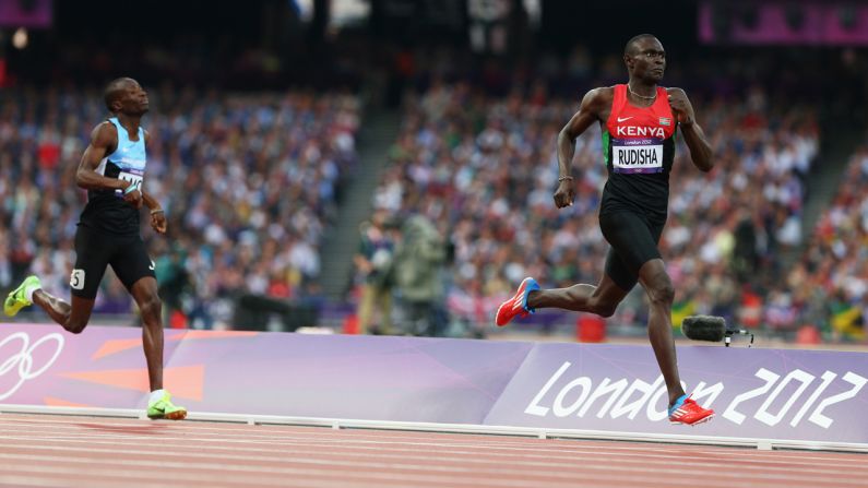 David Lekuta Rudisha of Kenya approaches the finish line ahead of Nijel Amos of Botswana to win gold and set a world record in the men's 800-meter final.