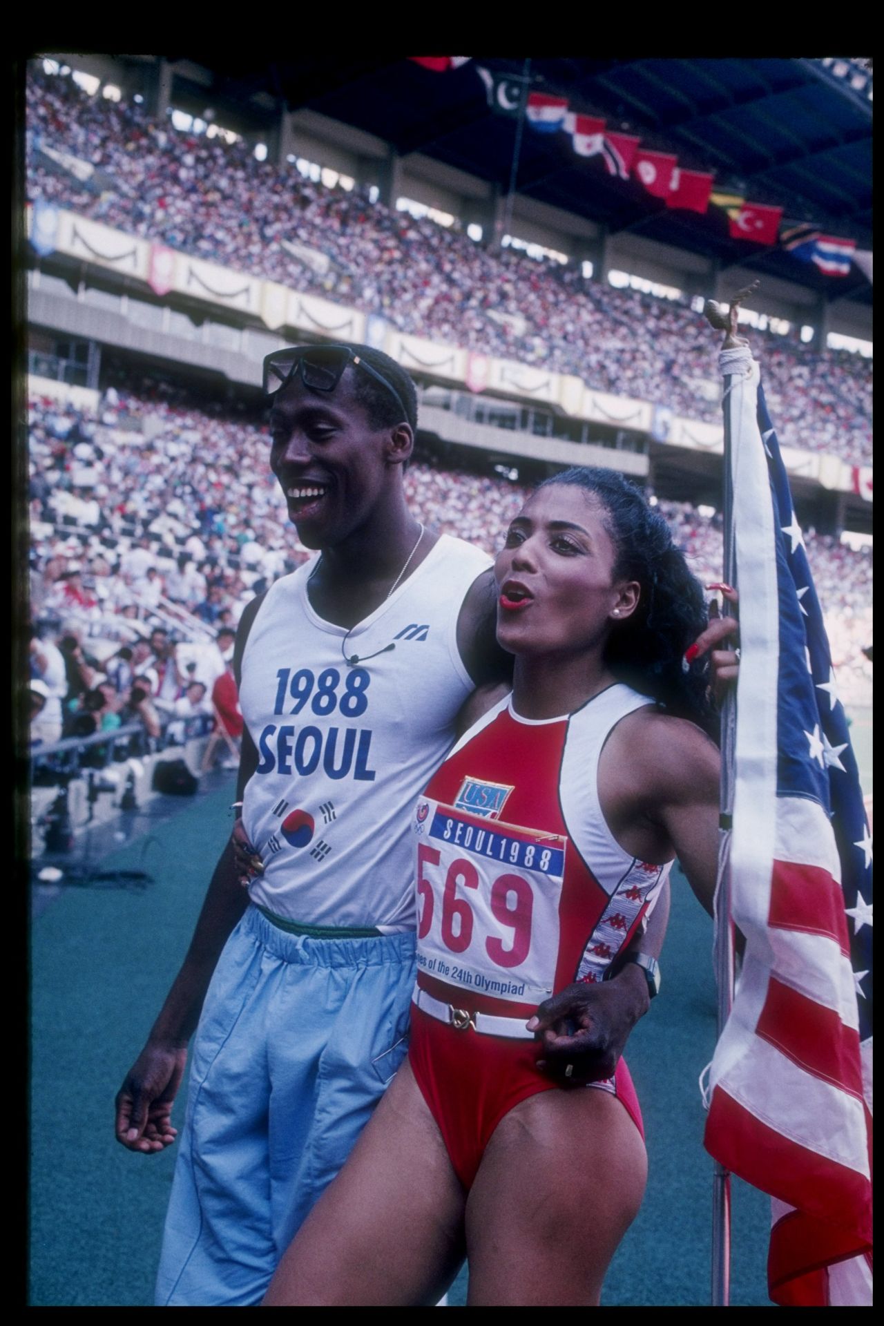 After winning her first gold, she went over to embrace her husband. She would later win the 200 meter final in a world record time. That record also still stands to this day.