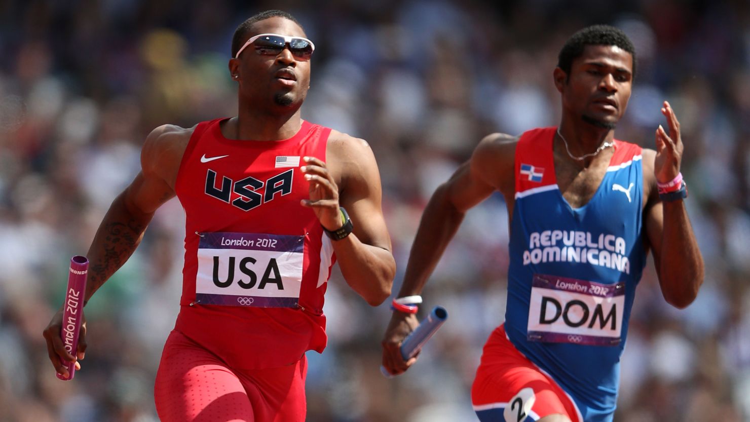 Manteo Mitchell of the United States and Gustavo Cuesta of Dominican Republic compete Thursday.
