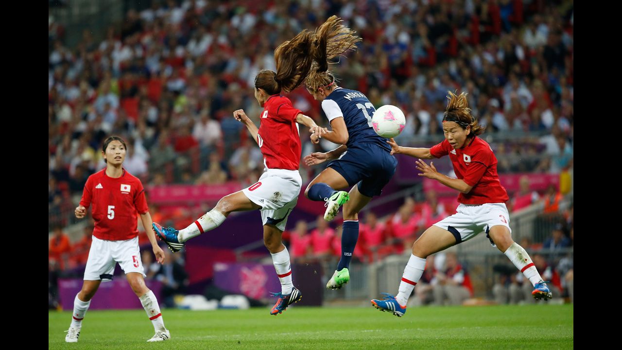 Forward Alex Morgan of the United States battles for the ball during Thursday's match against Japan.