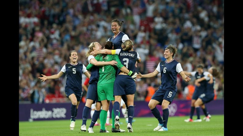 No. 1 Hope Solo, No. 7 Shannon Boxx, No. 3 Christie Rampone, No. 6 Amy LePeilbet and No. 5 Kelley O'Hara of the United States celebrate after defeating Japan by a score of 2-1 to win the women's football gold medal.