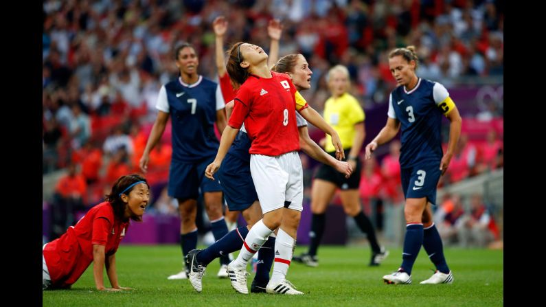 No. 8 Aya Miyama of Japan reacts after hitting the cross bar on a shot in the first half against the United States during the women's football gold medal match.