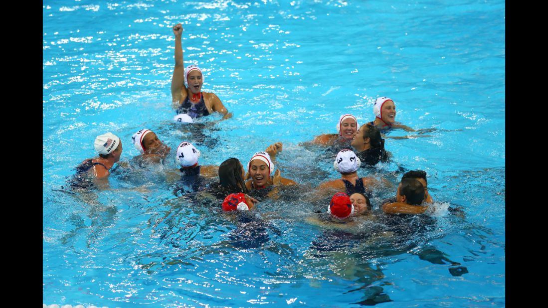The U.S. team celebrates its gold medal win at the Water Polo Arena in London.