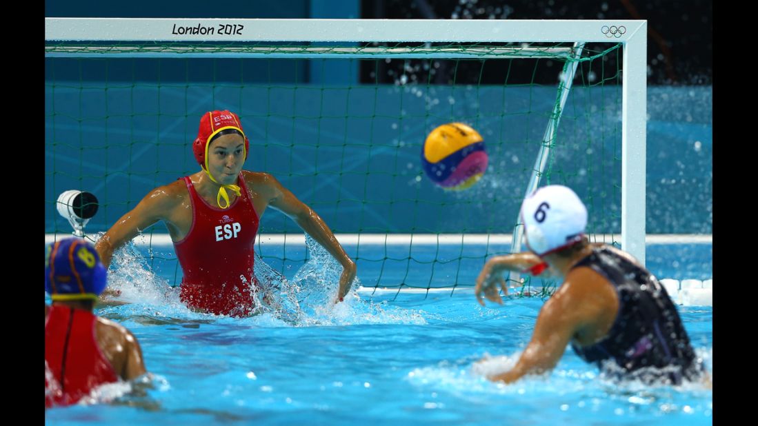 Maggie Steffens of the United States shoots and scores a goal against Spain in the women's water polo match Thursday.