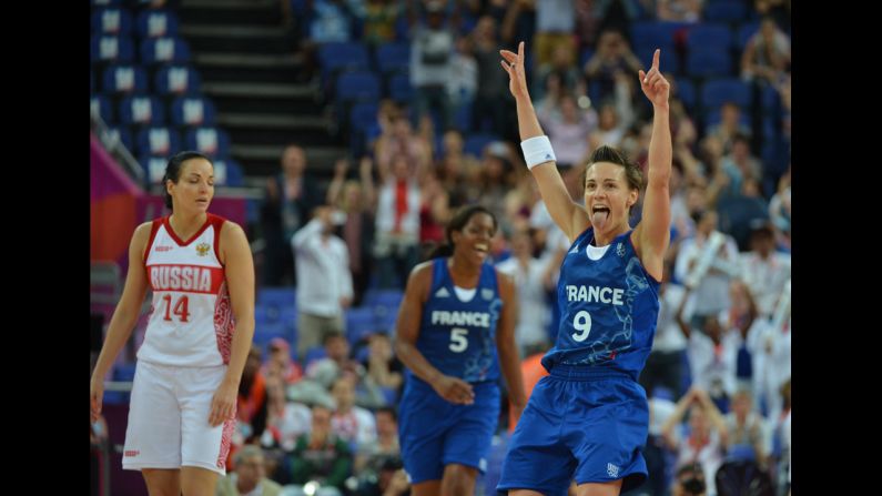 French guard Celine Dumerc celebrates after winning 81-64 against Russia during the women's semifinal basketball game between Russia and France.