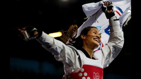 Li-Cheng Tseng of Chinese Taipei celebrates defeating Suvi Mikkonen of Finland during the women's 57 kilogram tae kwon do bronze medal finals.