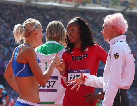 From left, Adonia Steryiou of Greece, Brigetta Barrett of the United States and Ariane Friedrich of Germany converse during the women's high jump qualification.