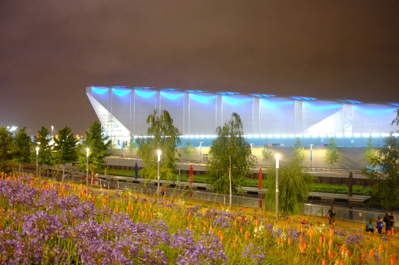 The Water Polo Arena, seen beyond the River Lea, is the first dedicated water polo venue to be built for an Olympic Games. Its components will be reused or recycled after the Games. 