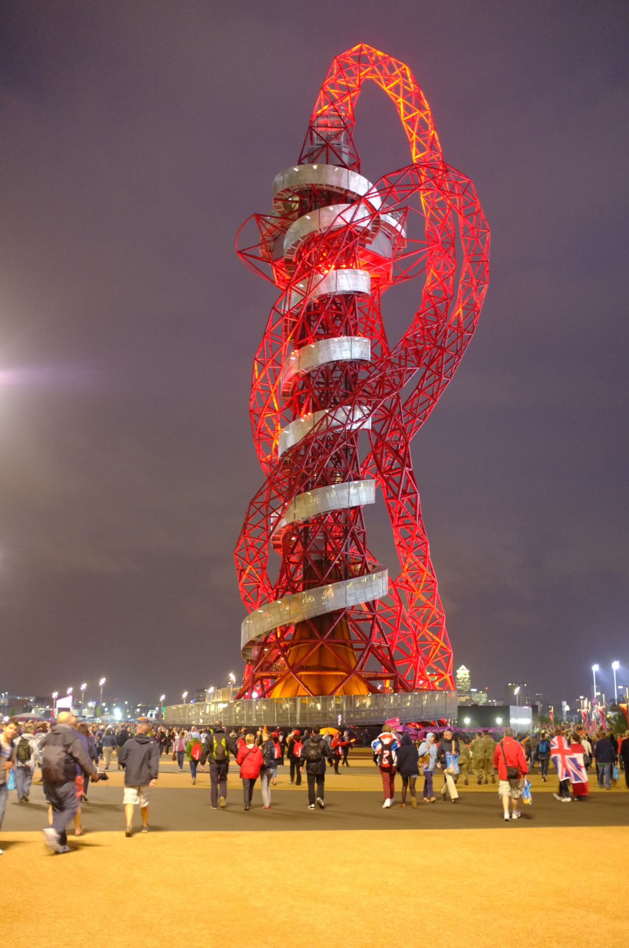 Anish Kapoor's "Orbit Tower," a permanent artwork and the tallest art structure in Britain, attracted many of my fellow stragglers, its vivid red form illuminated brightly against the sky. 