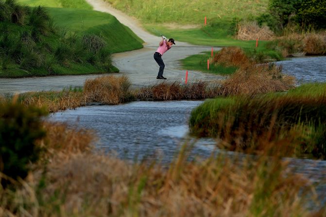 Luke Donald of England hits a shot on the 2nd hole.