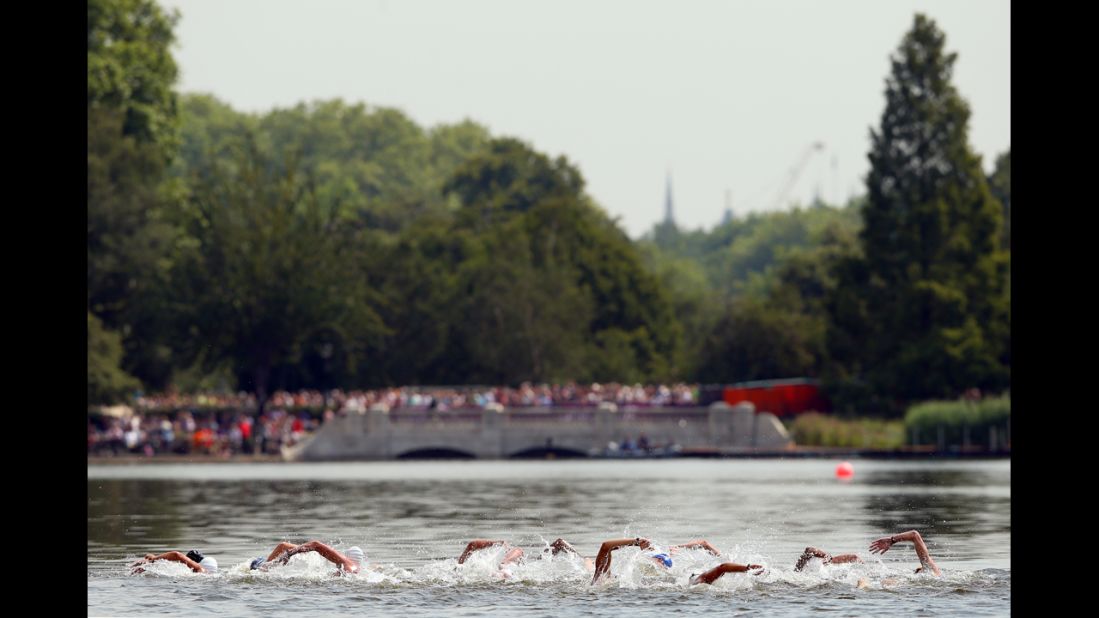 Swimmers compete in the men's marathon 10-kilometer swim at Hyde Park in London.