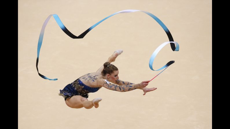 Australia's Janine Murray performs her ribbon program during the individual all-around qualifications of the rhythmic gymnastics event.