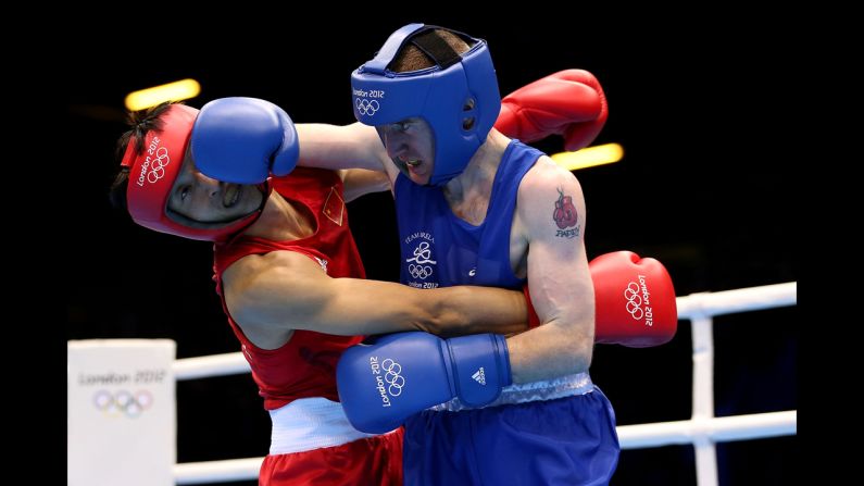 Ireland's Paddy Barnes delivers a punch against Shiming Zou of China during the men's light flyweight (49-kilogram) boxing semifinal bout.
