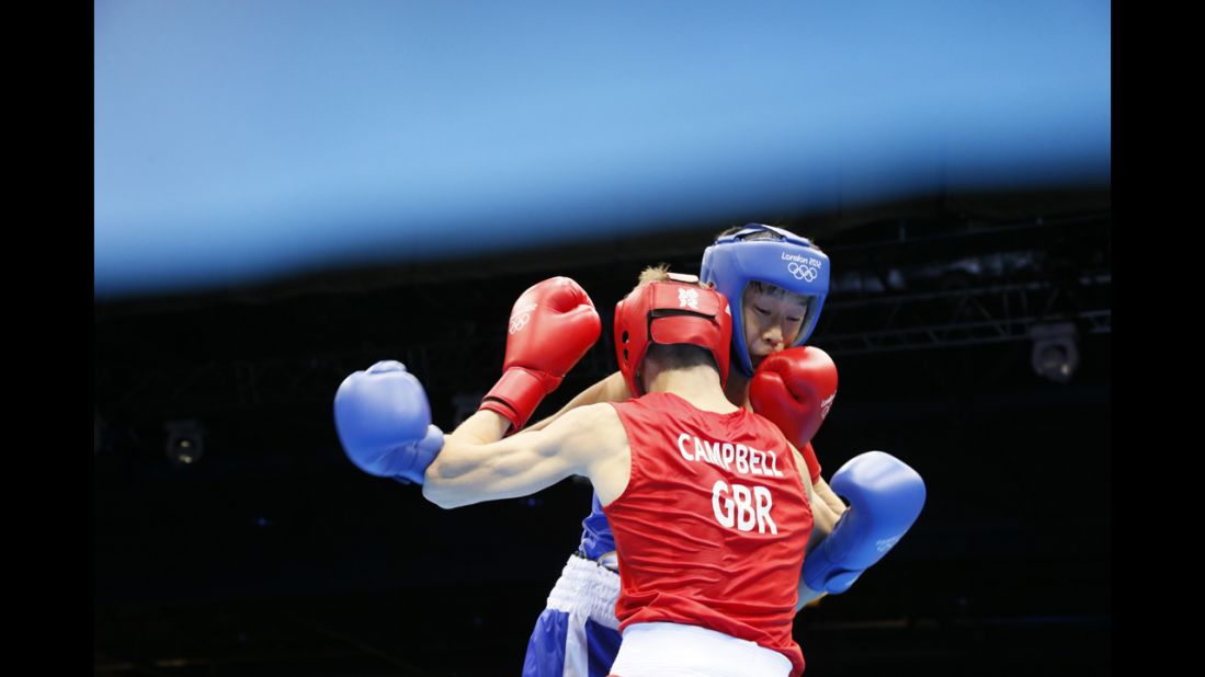Great Britain's Luke Campbell, left, defends against Satoshi Shimizu of Japan during the men's bantamweight (56-kilogram) boxing semifinals.