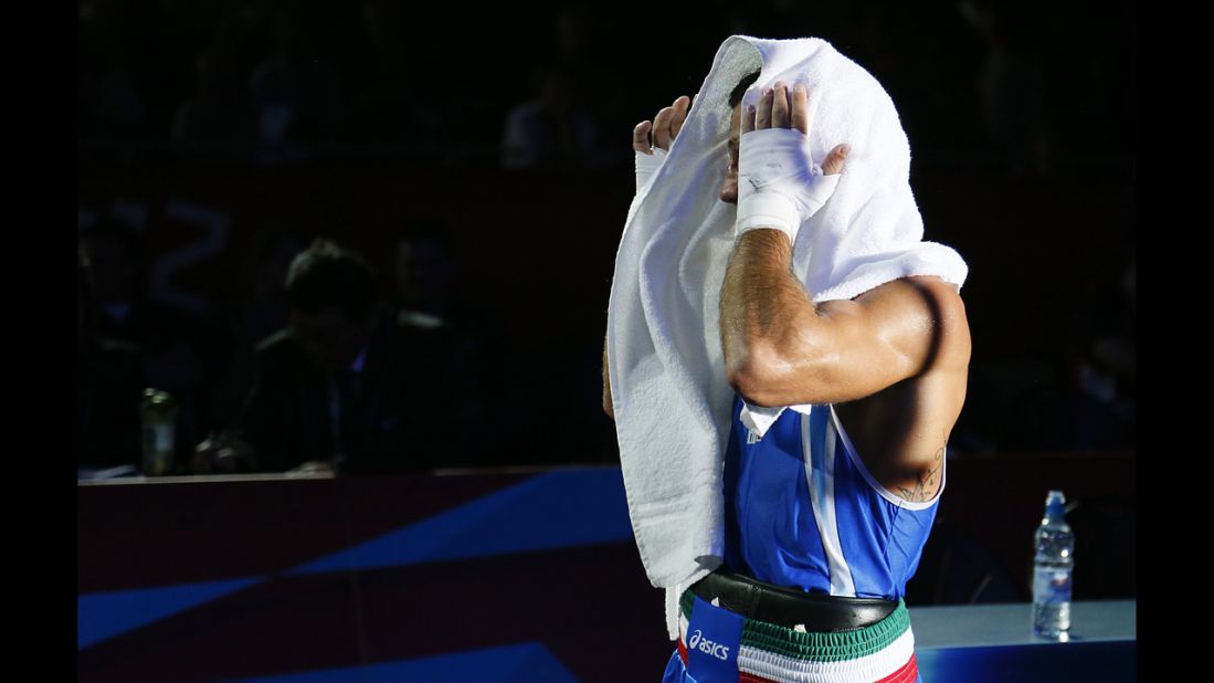 Italy's Vincenzo Mangiacapre leaves the ring after his loss to Cuba's Roniel Iglesias Sotolongo in the men's light welterweight (64-kilogram) boxing semifinals.