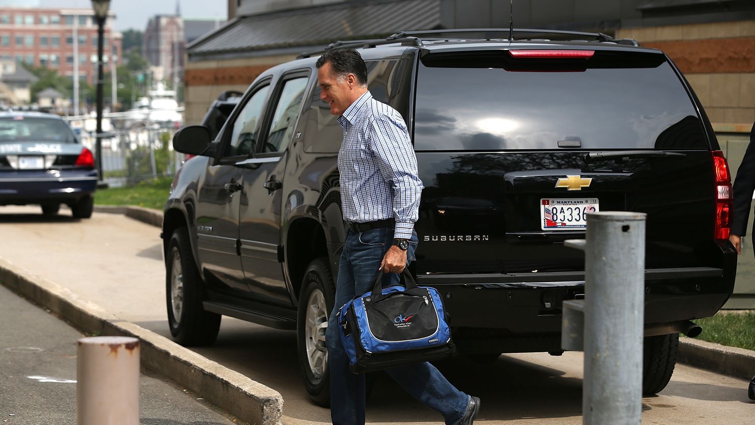 Mitt Romney arrives at his campaign headquarters Friday in Boston.
