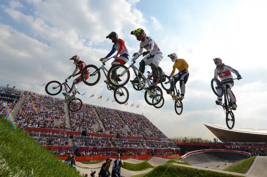 From left, Latvia's Maris Strombergs, France's Joris Daudet, Colombia's Carlos Mario Oquendo Zabala, Australia's Sam Willoughby and Switzerland's Roger Rinderknecht take a jump during the BMX cycling men's semifinal.