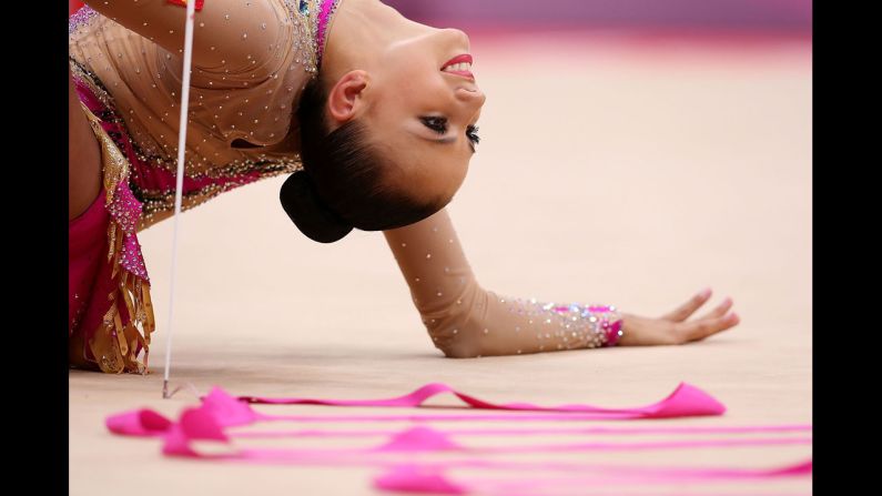 Russian gymnast Daria Dmitrieva performs in the rhythmic gymnastics individual all-around competition.