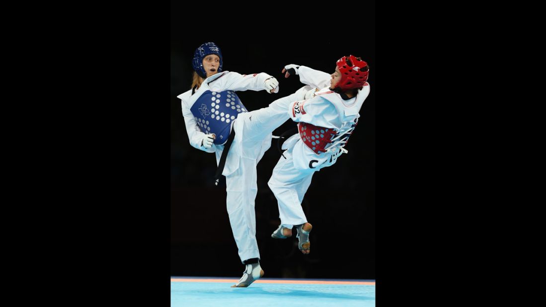 Canada's Karine Sergerie spars with Slovenia's Franka Anic during the women's under 67-kilogram taekwondo quarterfinal.