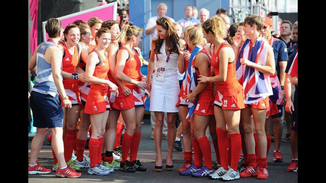 Catherine, Duchess of Cambridge, center, talks to Great Britain's field hockey team members after they won the bronze medal against New Zealand.