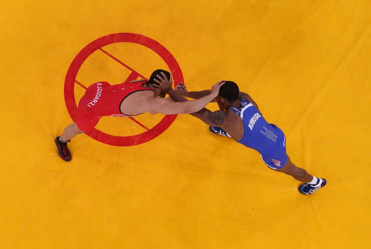 Burroughs, in blue, competes with Goudarzi in the gold medal match.
