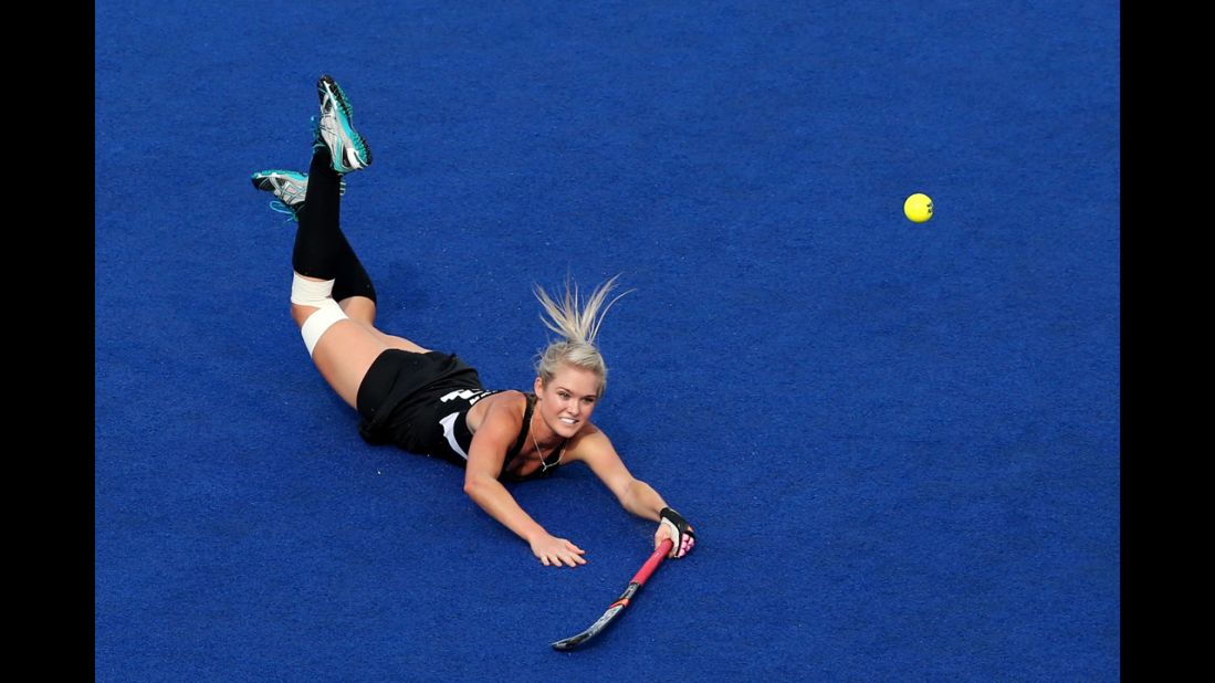 Samantha Harrison, No. 20 of New Zealand, dives after the ball in the second half against Great Britain during the women's hockey bronze medal match.
