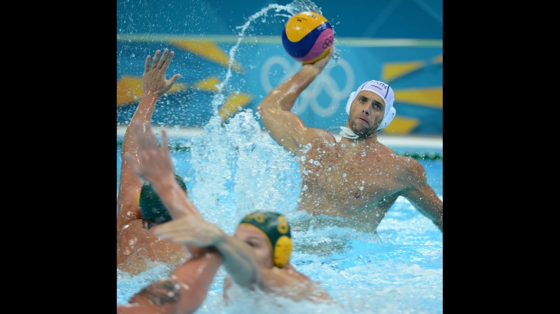 Hungary's Tamas Kasas passes the ball during the men's water polo classification 5-8 between Hungary and Australia.