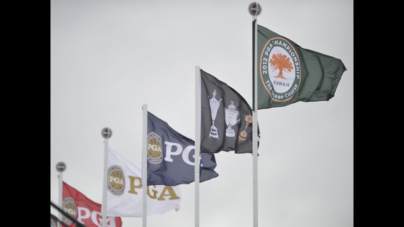 The wind whips the PGA flags on Friday.
