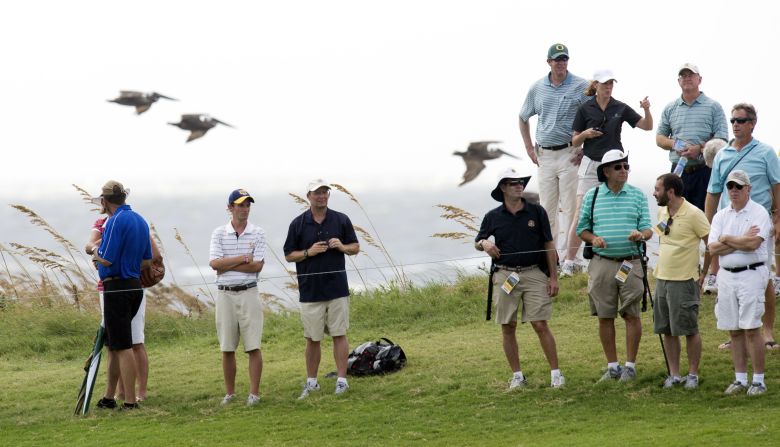 Golf fans watch during the second round of the championship.