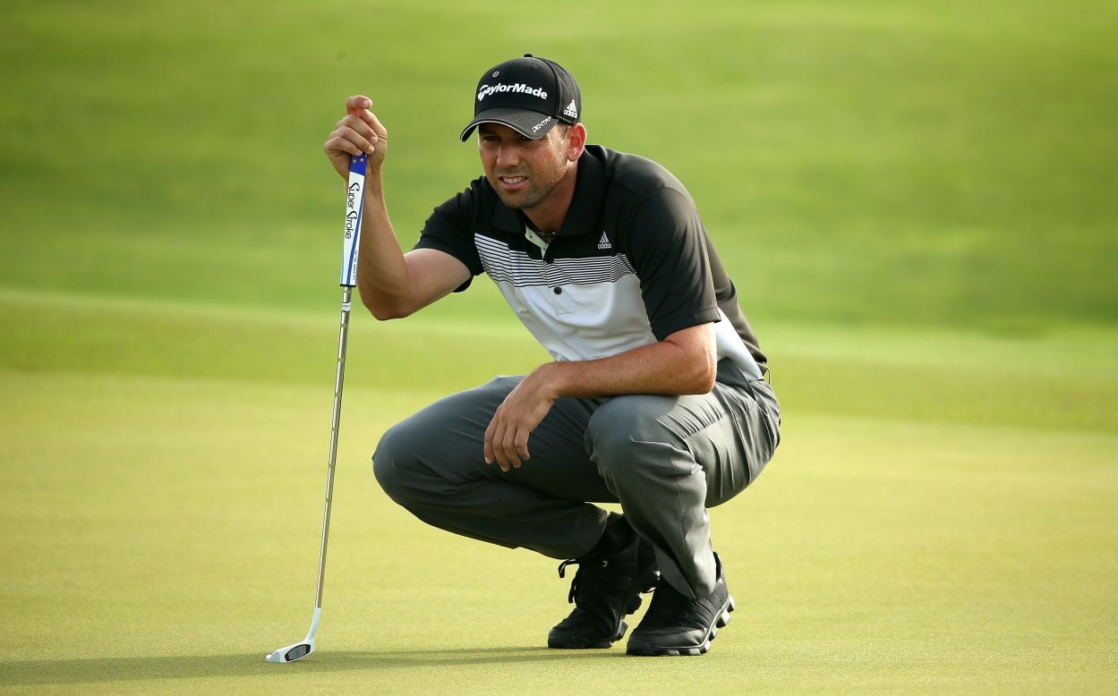 Spanish golfer Sergio Garcia lines up a putt on the 10th green.