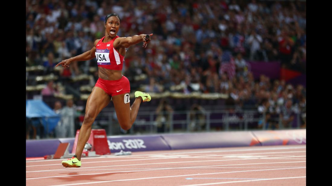 Carmelita Jeter of the United States celebrates winning gold in the women's 4x100-meter relay.