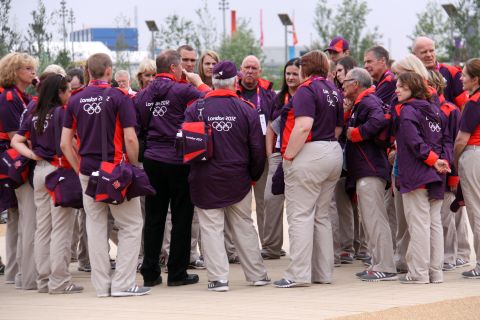 The volunteers have been credited with helping ensure the success of London's Olympics, creating a happy, positive mood in the city.