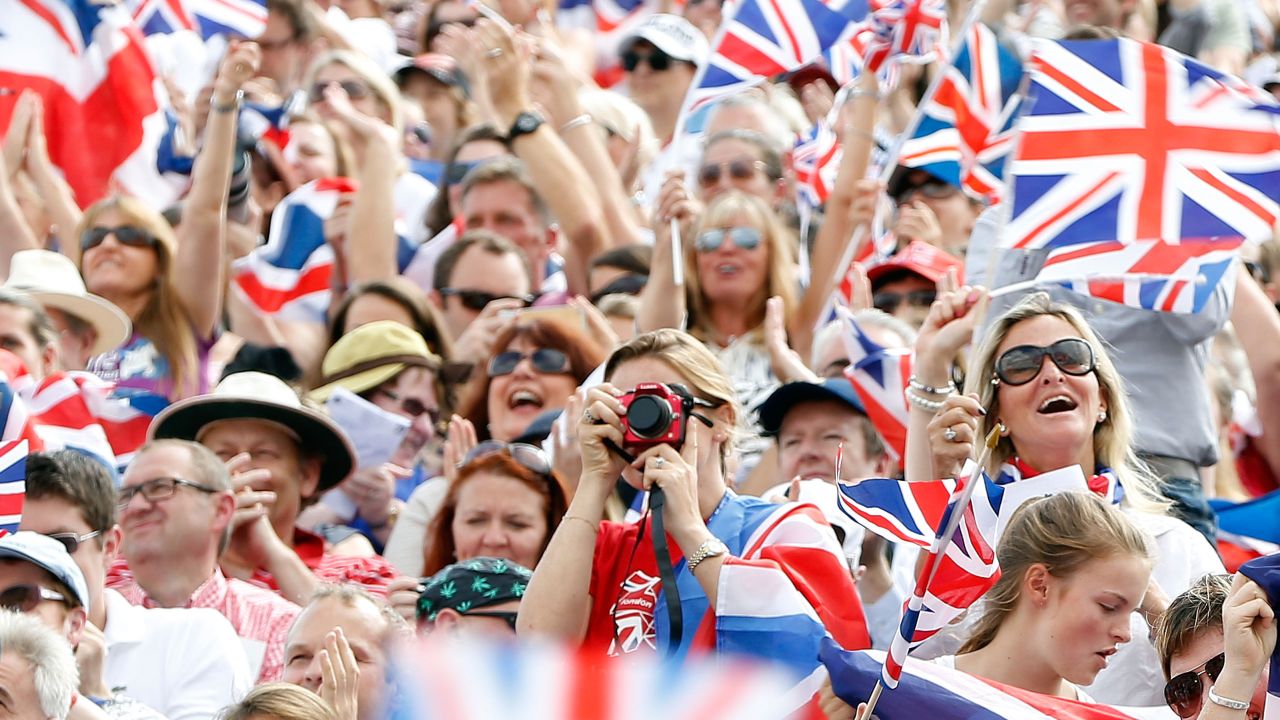 Fans of the home side, Team GB, wave Union Jack flags during the Olympic Games