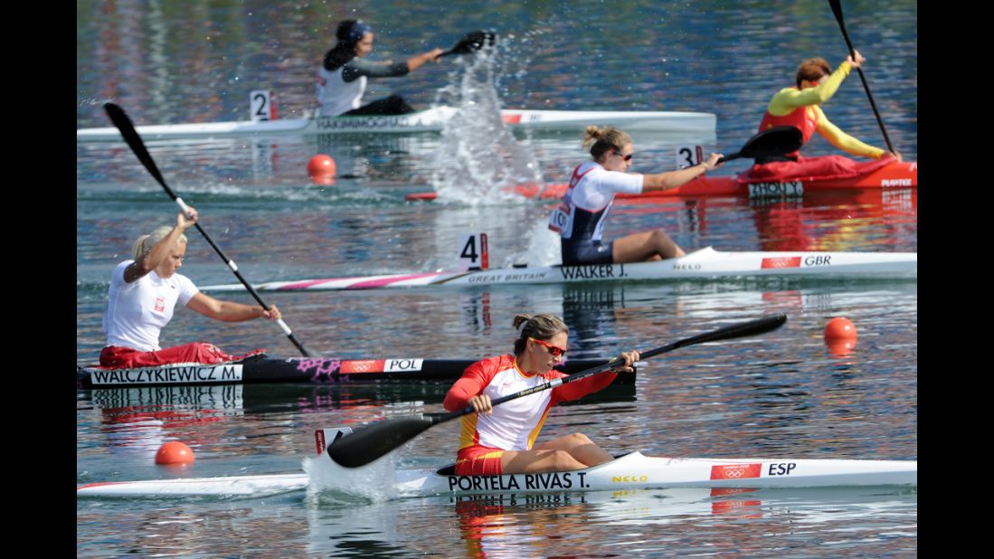 Competitors race in the women's kayak single 200-meter sprint heats at Eton Dorney in Windsor, England.