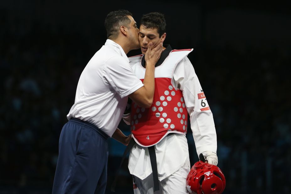 American Steven Lopez walks off after losing to Ramin Azizov of Azerbaijan in the taekwondo bout.