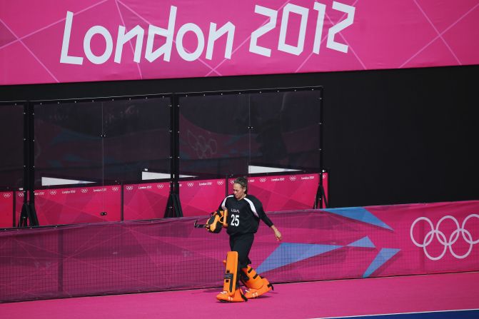 U.S. goalkeeper Amy Swensen walks off the pitch after being substituted for an offensive player in the last minutes of the women's field hockey classification match between the United States and Belgium. Check out<a href="index.php?page=&url=http%3A%2F%2Fwww.cnn.com%2F2012%2F08%2F11%2Fworldsport%2Fgallery%2Folympics-day-fifteen%2Findex.html" target="_blank"> Day 15 of the competition </a>from Saturday, August 11.