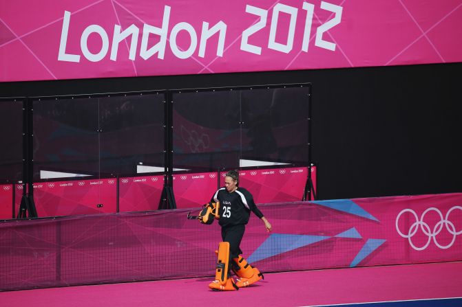 U.S. goalkeeper Amy Swensen walks off the pitch after being substituted for an offensive player in the last minutes of the women's field hockey classification match between the United States and Belgium. Check out<a href="http://www.cnn.com/2012/08/11/worldsport/gallery/olympics-day-fifteen/index.html" target="_blank"> Day 15 of the competition </a>from Saturday, August 11.