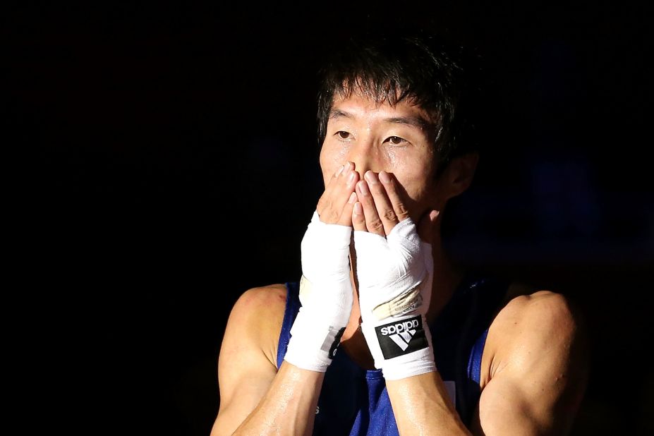 Soonchul Han of Korea reacts after he was declared the winner against Evaldas Petrauskas of Lithuania during their men's light (60 kilogram) boxing semifinal bout.
