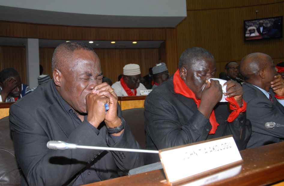 Members of Ghana's parliament weep on hearing the news of Mills' sudden death on July 24.