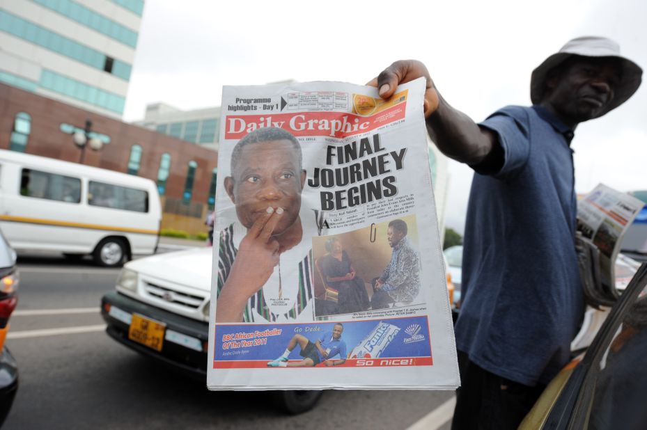 A newspaper vendor in Accra holds a copy a daily Wednesday featuring Mills on the front page. The president's death came several days after he celebrated his 68th birthday. He had said he would run for re-election in December.
