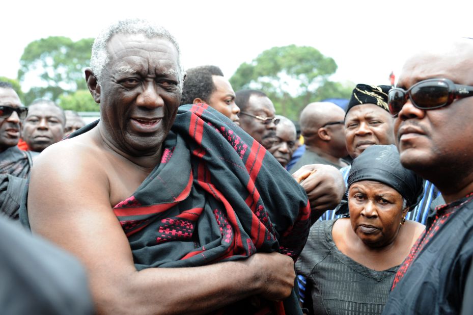 Former Ghanaian president John Kufuor arrives to pay respect to Mills at the parliament in Accra on Wednesday.