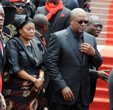 John Dramani Mahama, who was sworn in as Ghana's president after the death of Mills, and his wife arrive Wednesday to parliament to pay their respects. 