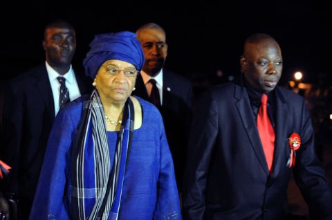 Liberian president Ellen Johnson Sirleaf is escorted by Ghanaian foreign minister Muhammad Mumunis upon her arrival Thursday in Accra to attend the funeral. 