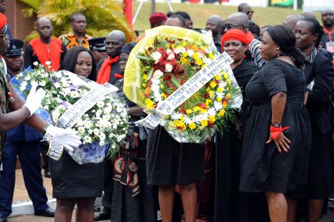 Members and staff of Ghana's parliament arrive to pay their last respects to Mills on Wednesday.