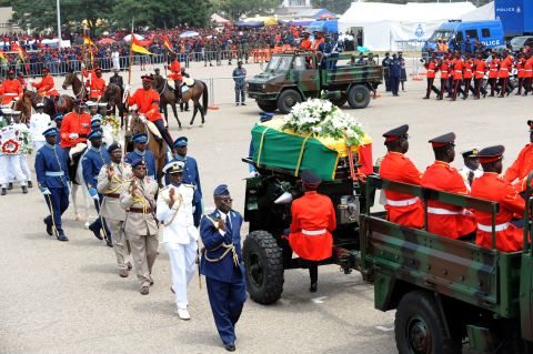 The coffin of Mills is escorted Friday to the Independence Park in Accra for the funeral service. A military cortege conveyed Mills' body from the State House parliamentary complex, where it had lain in state since Wednesday, to Independence Square, where more than 10,000 people had gathered.