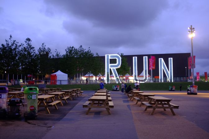 The picnic area outside the Copper Box, crowded earlier in the day, was almost deserted at dusk. Artist Monica Bonvicini's permanent sculpture, "Run," shone brightly in front of it. The venue will become a multi-purpose venue for community and sporting events. 